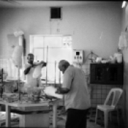 Two orthopedic technicians in the plaster room while preparing the mold for prostheses
