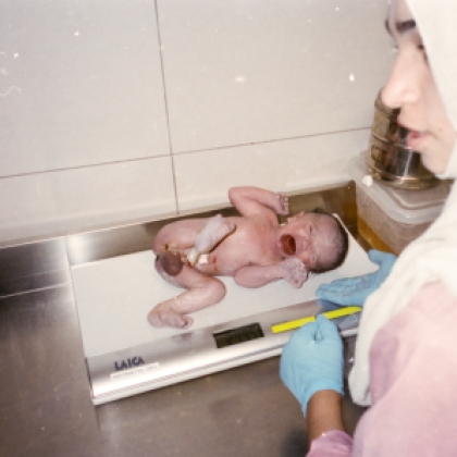 A newborn baby is weighed. Inside Anabah hospital there are around 700 births per month